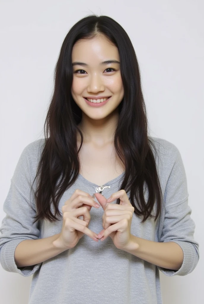 Only one woman with a cute smile is in a pose wearing off-shoulder pajamas, making a firm big heart shape with both hands, and holding them in front of her chest, View above collarbone、The background is a monotone 

