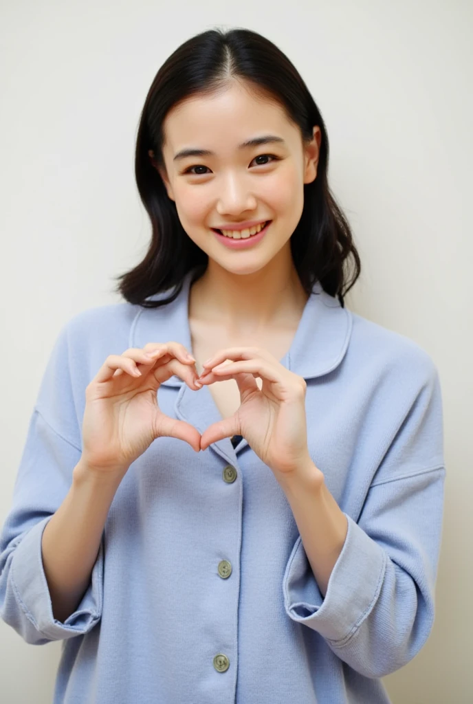 Only one woman with a cute smile is in a pose wearing off-shoulder pajamas, making a firm big heart shape with both hands, and holding them in front of her chest, View above collarbone、The background is a monotone 

