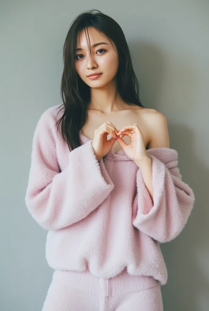 Only one woman with a cute smile is in a pose wearing off-shoulder pajamas, making a firm big heart shape with both hands, and holding them in front of her chest, View above collarbone、The background is a monotone 

