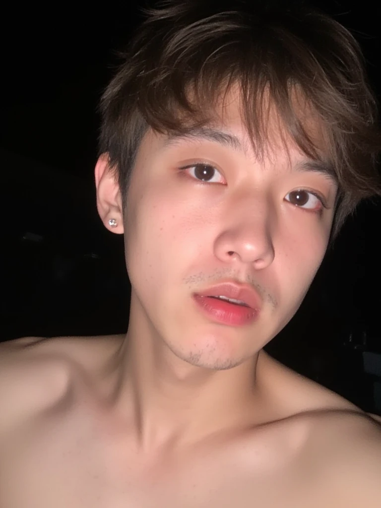 The image is a close-up photograph of a young Asian man with a fair complexion. His face is covered in male semen. He is indifferent about the male semen on his face. The semen is on his most predominant features like his nose, lips, and pecs, His face dominates the frame, occupying the majority of the image, with his eyes, nose, and lips prominently visible. He has large, almond-shaped eyes with long, thick eyelashes, and his skin is smooth and soft. His lips are full and slightly parted, revealing a natural, rosy hue. He wears a silver stud earring in his left ear, adding a subtle touch of personal style. His hair is short, dark brown with subtle highlights, and it partially covers his forehead, giving a slightly tousled, casual look. The background is out of focus, but it appears to be a dark, possibly indoor setting, which emphasizes his face and provides a stark contrast to his light complexion. He is wearing no shirt, and has a muscular figure with large pecs which is visible at the bottom of the image. The overall mood of the photograph is intimate and personal, capturing a candid moment with a natural, unfiltered aesthetic. His face is covered in male semen. He is indifferent about the male semen on his face. The semen is on his most predominant features like his nose, lips, and pecs,
