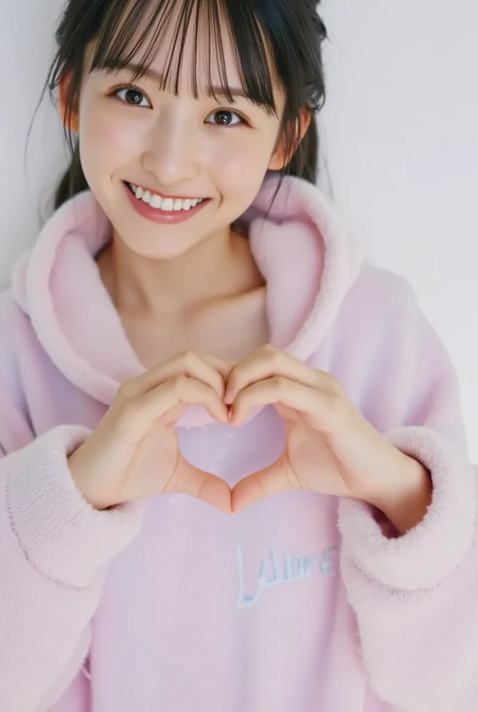 Only one woman with a cute smile wears cute, fluffy off-shoulder pajamas, makes a big heart shape with both hands, and poses them in front of her chest, View above collarbone、The background is a monotone 

