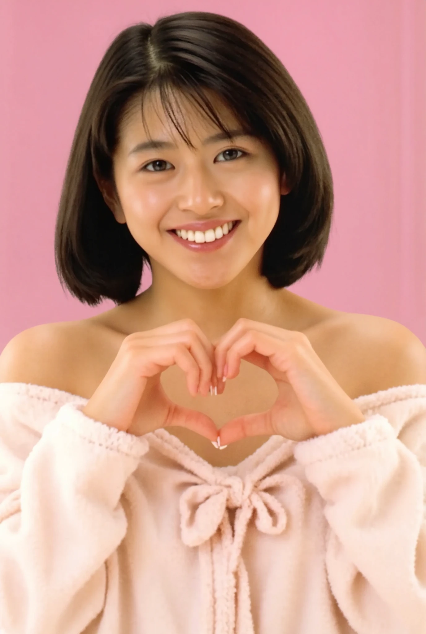 Only one woman with a cute smile wears cute, fluffy off-shoulder pajamas, makes a big heart shape with both hands, and poses them in front of her chest, View above collarbone、The background is a monotone 

