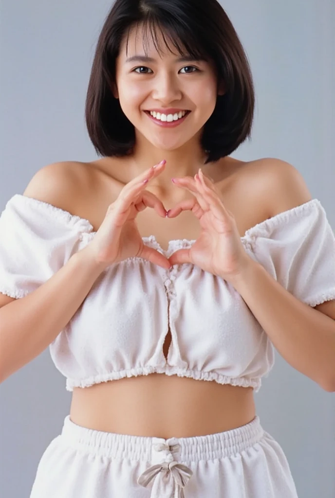 Only one woman with a cute smile wears cute, fluffy off-shoulder pajamas, makes a big heart shape with both hands, and poses them in front of her chest, View above collarbone、The background is a monotone 

