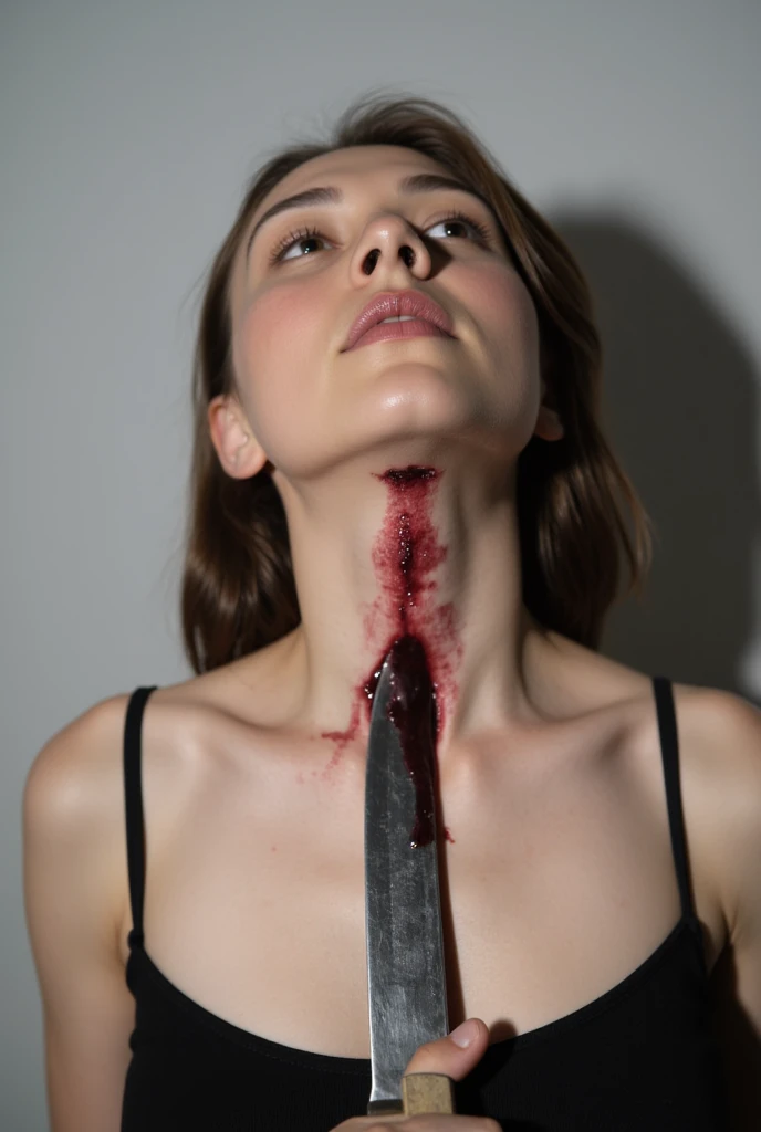 A skinny, nude girl with and a smooth, hairless body in the midst of an extreme, hardcore BDSM scenario. Her body is contorted into unnatural positions as she's bound in various bondage contraptions. The lighting in the room is dim, casting eerie shadows across her exposed flesh. The girl's wrists are tied tightly behind her back and secured to a metal frame above her head, forcing her to arch her back painfully. Her ankles are spread wide apart, secured in a spreader bar, exposing her most intimate areas. A long, thick metal rod pierces through her labia, held in place by a metal ring that runs through her clit hood, making it impossible for her to touch herself or find any relief from the intense sensations. Her mouth is forced open by a large, clear gagball, which fills her mouth and allows her to moan and groan in agony as she struggles against her restraints. The air is thick with the girl's muffled pleas and the sound of her flesh being stretched and pulled by the relentless bondage. The contrast between the girl's smooth, pale skin and the harsh metal bindings emphasizes her vulnerability and the brutality of her situation.