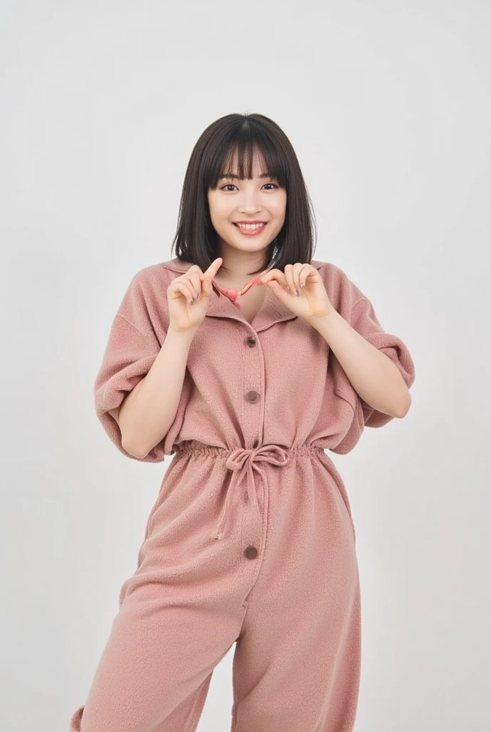 Only one woman with a cute smile wears cute, fluffy off-shoulder pajamas, makes a big heart shape with both hands, and poses them in front of her chest, View above collarbone、The background is a monotone 

