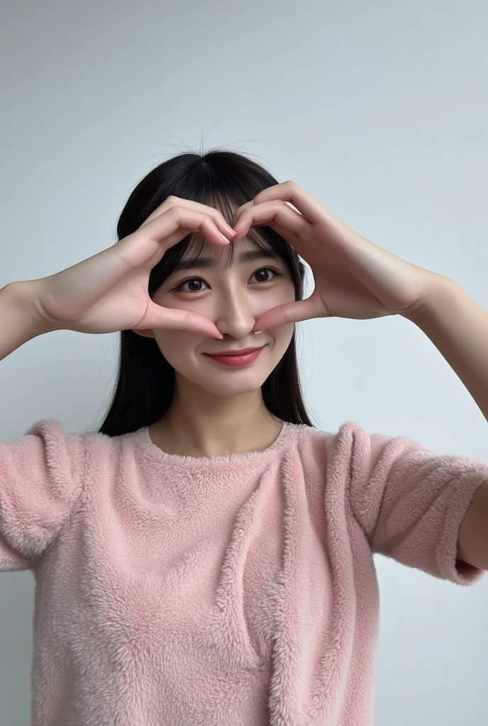 Only one woman with a cute smile wears cute, fluffy off-shoulder pajamas, makes a big heart shape with both hands, and poses them in front of her chest, View above collarbone、The background is a monotone 

