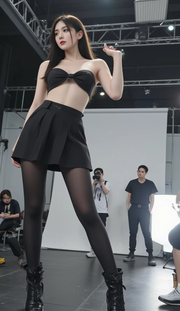 fashion photoshoot scene, a giant Chinese female celebrity taking various poses, towering over the set, wearing an OL (office lady) outfit with high heels, perfect facial features, slim body, her legs in black stockings elongated and dominating the scene -- the photographers, lighting technicians and other crew members appear tiny in comparison -- professional studio setup with background lights and cameras, dramatic contrast in scale, detailed and realistic lighting, high-fashion vibe, sleek and modern -- focus on the giantess's confident and elegant poses, her powerful presence in the scene, with a mix of admiration and awe from the tiny crew -- cinematic composition, high-quality, sharp, and photorealistic.