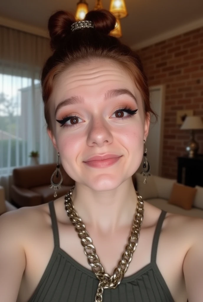 The image is a high-resolution photograph of a young woman taking a selfie in what appears to be a cozy, indoor setting. She is a Caucasian woman with fair skin, freckles, and auburn hair styled in a loose updo with a metallic hair tie. Her facial expression is playful, with a slight smile and raised eyebrows, and she is wearing dark, bold makeup including eyeliner and lipstick.