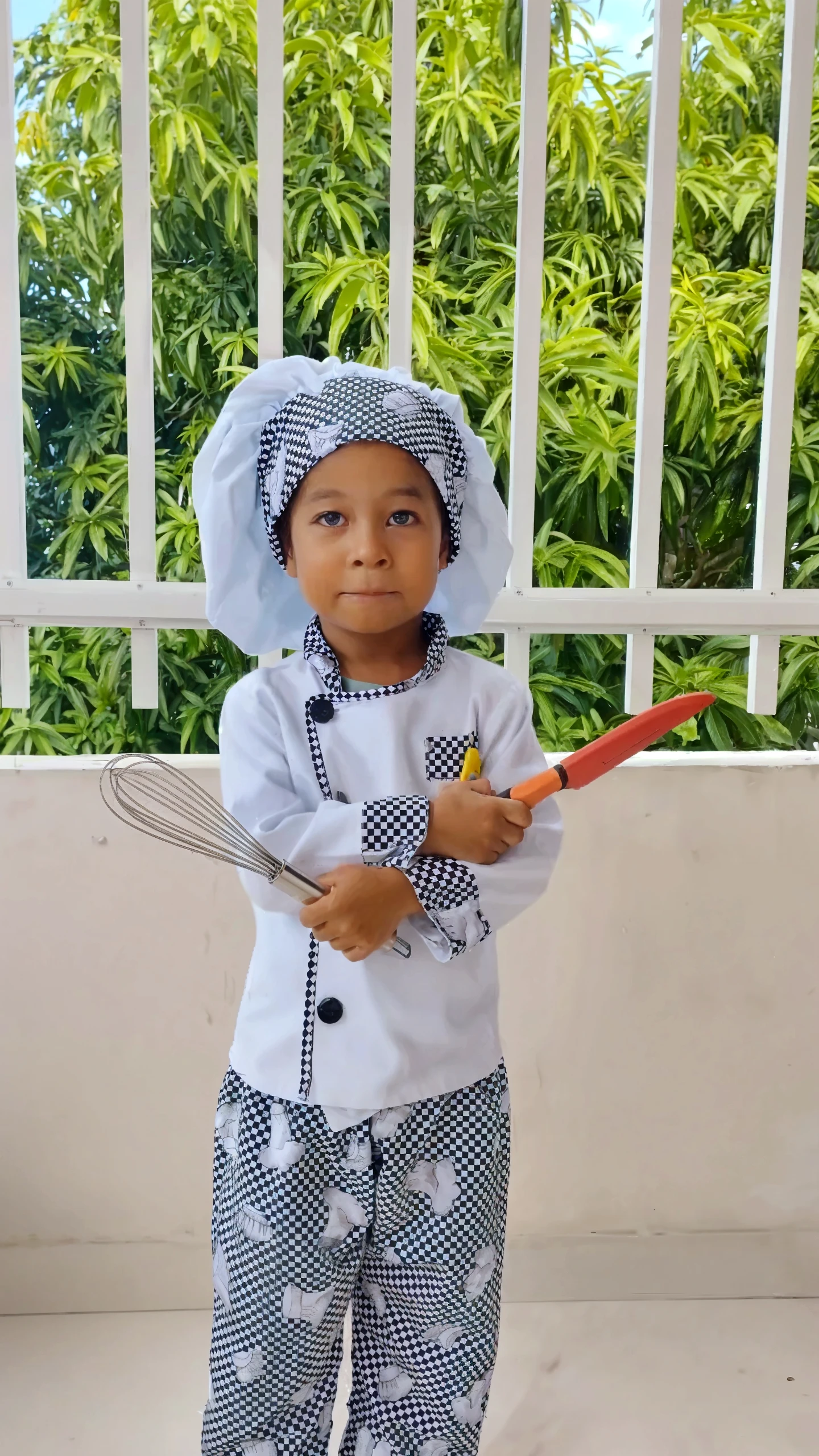 guttonerdreliberate1, portrait of a 3-year-old boy wearing glasses, (posing for photo: 1.2), hands behind his body, wearing, (white apron: 1.3) cook, chef, masterchef, (red cap: 1.5) without print and without embroidery. Industrial kitchen scenario. Detailed, realistic, Drawing by alex ross