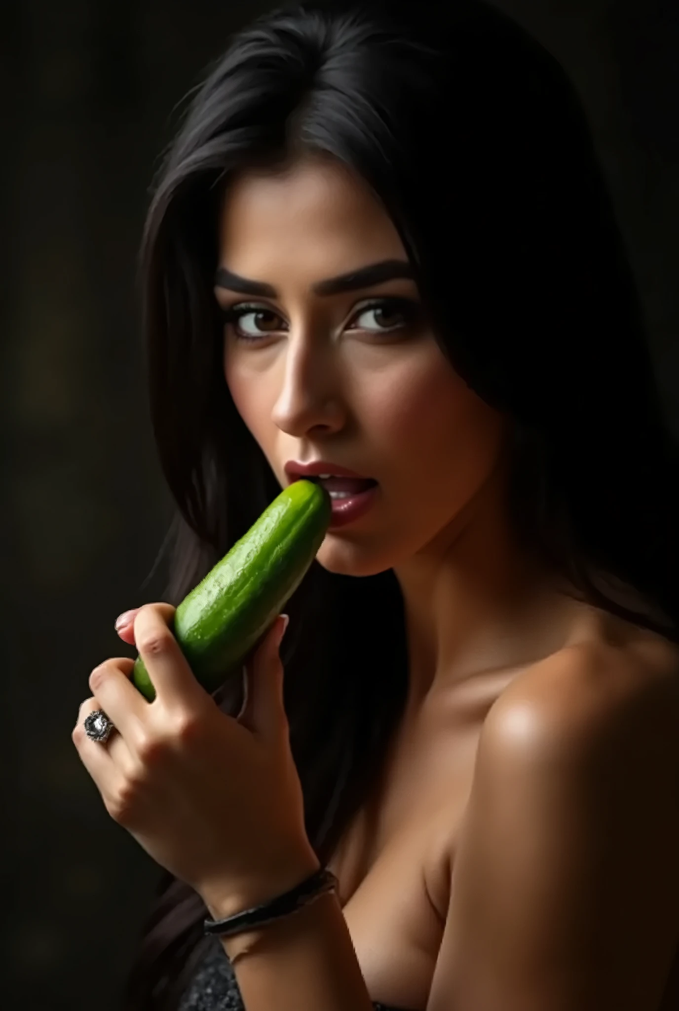 A very sweet and very beautiful veiled woman with big breasts and very sexy is putting a serrated cucumber in her mouth., he is very aroused and sweaty wet