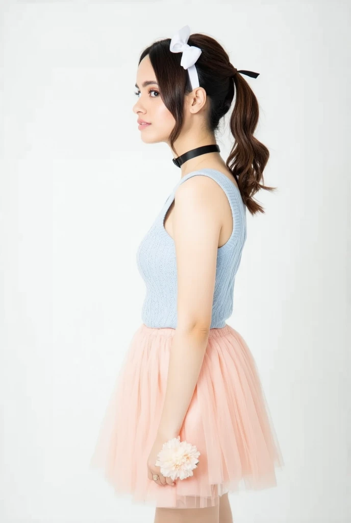 a young woman stands against a stark white backdrop. She is dressed in a light blue sleeveless dress with a pink skirt. The skirt is adorned with a light pink flower, adding a touch of color to the scene. The woman's hair is styled in a sleek bob, with a white bow at the top of her head. She has a black choker around her neck. Her hair is pulled back in a ponytail, and she is wearing a white headband.