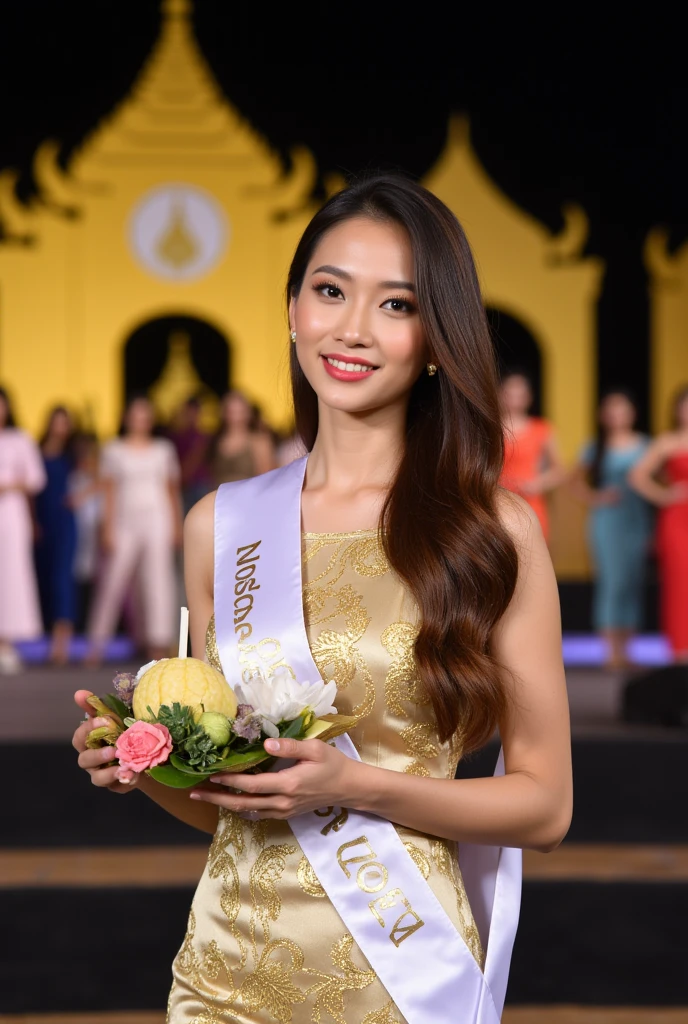 Create a detailed portrait of a beautiful Thai woman holding a lotus-shaped floating basket (krathong) made from banana leaves and decorated with flowers, candles, and incense sticks. She wears a luxurious  silk dress adorned with intricate golden patterns, delicate jewelry.She has a beautiful white competitor ribbon on her chest. Text: 'Noppamas Queen Contest 2024' in clean, simple letterforms, positioned center-left on the the ribbon. Her hair is neatly styled, and she smiles softly, looking at the camera. The atmosphere is bright and elegant, suitable for formal occasions or ceremonies. The scene is set at night on a stage with a wide view, featuring a backdrop of a golden Thai house cutout. There are many competitors in various colored clothes behind her. Her slender figure and gorgeous body are showcased. Long, wavy brown hair cascades down her back, framing her stunning features, adding to her sensual pose. The soft lighting highlights the curves of her face and body, as she looks directly at the viewer with an inviting gaze