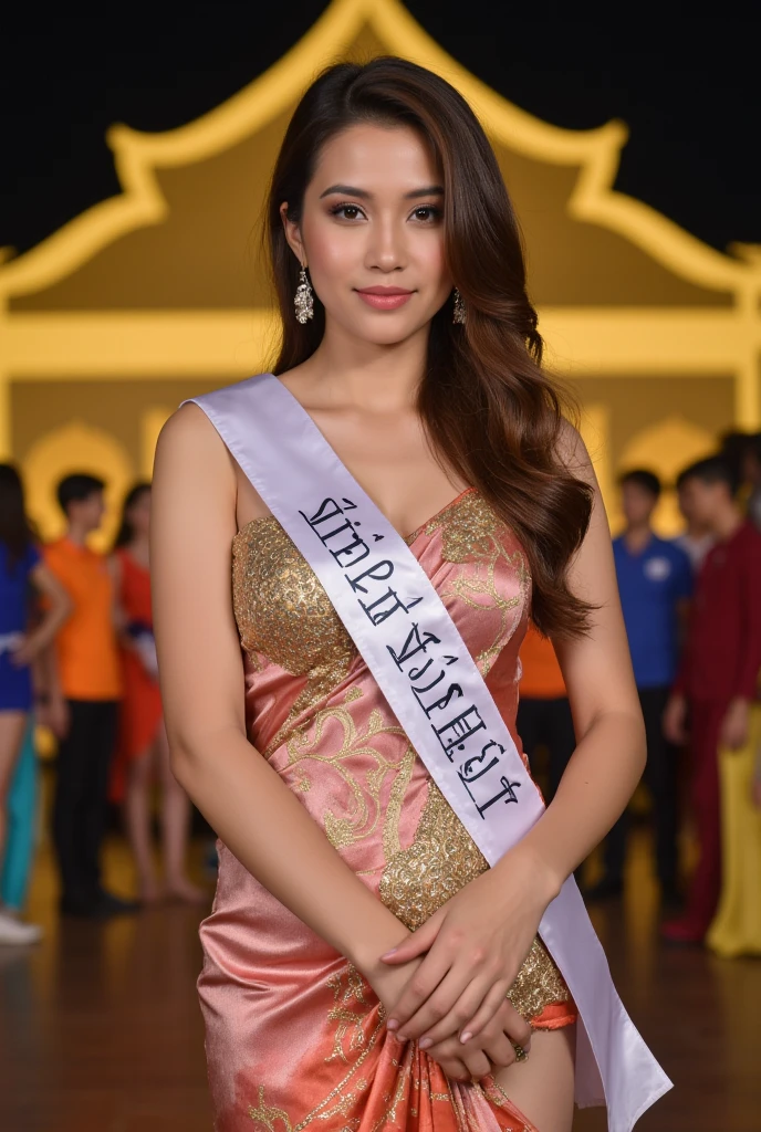 Create a detailed portrait of a beautiful Thai woman holding  Thai Krathong . She wears a luxurious  silk Thai sabai adorned with intricate golden patterns, delicate jewelry.She has a beautiful white competitor ribbon on her chest. Text: 'Noppamas Queen Contest 2024' in clean, simple letterforms, positioned center-left on the the ribbon. Her hair is neatly styled, and she smiles softly, looking at the camera. The atmosphere is bright and elegant, suitable for formal occasions or ceremonies. The scene is set at night on a stage with a wide view, featuring a backdrop of a golden Thai house cutout. There are many competitors in various colored clothes behind her. Her slender figure and gorgeous body are showcased. Long, wavy brown hair cascades down her back, framing her stunning features, adding to her sensual pose. The soft lighting highlights the curves of her face and body, as she looks directly at the viewer with an inviting gaze