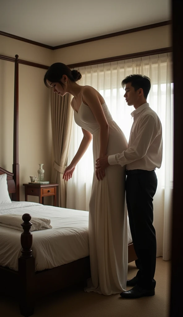 A very tall, slim Chinese giantess with an exceptionally high height and her short husband are in a very small, cramped bedroom with a low ceiling. The woman has a graceful, slender figure and is so tall that she must bend over slightly because the ceiling is too low for her to stand upright. Her height is highlighted by the fact that her head touches the ceiling, forcing her into this position. Her short adult husband, standing behind her, is only half her height, and his head lines up with her hips. The height difference between the couple is striking. The tall woman is bending forward with her hand resting on a small table for support, while her husband stands near her, emphasizing the visual contrast in height. The small size of the room, combined with the low ceiling, further accentuates the woman's towering stature.