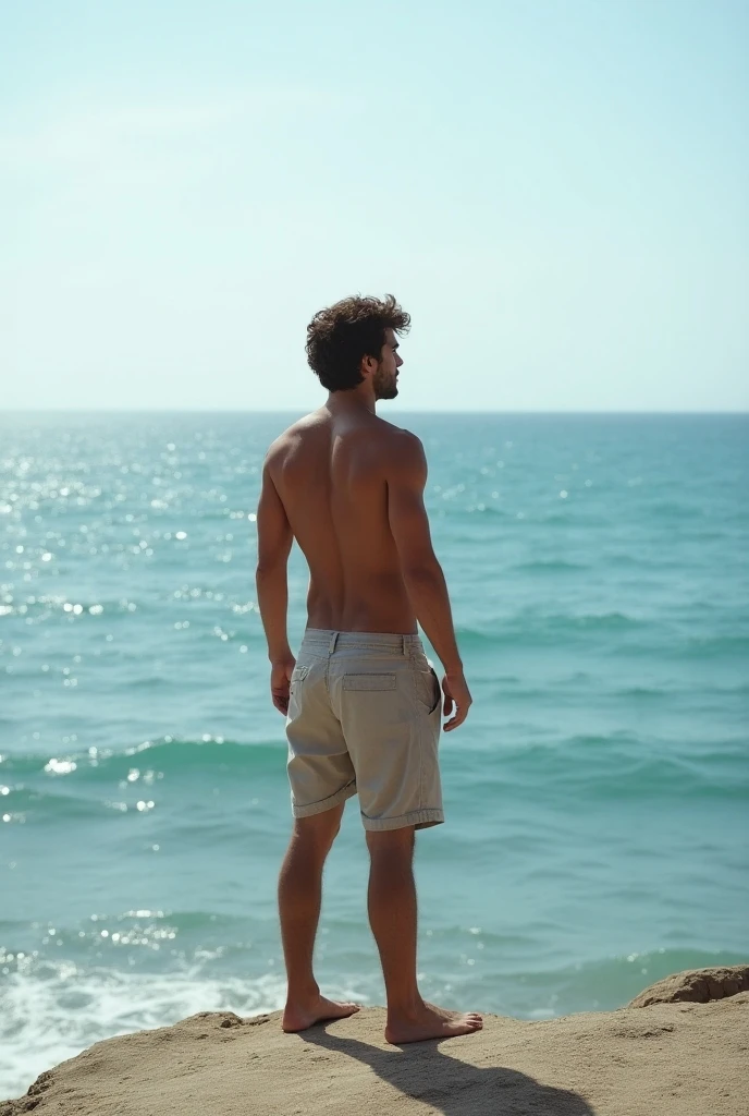By the sea topless young man with back shorts cross arm ang whole body