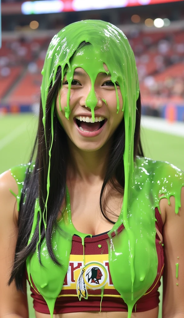 Photograph of beautiful 21-year-old Chinese girl covered in dripping green custard. Wearing Washington redskins cheerleader uniform. f/1.4 aperture. hyper-realistic style. Chinese girl. Long flowing black hair. Slime. Telephoto lens. 8k. Masterpiece. NFL football stadium. Football game in background.