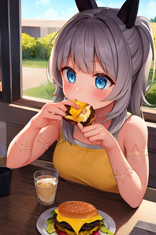 A girl eating a cheeseburger