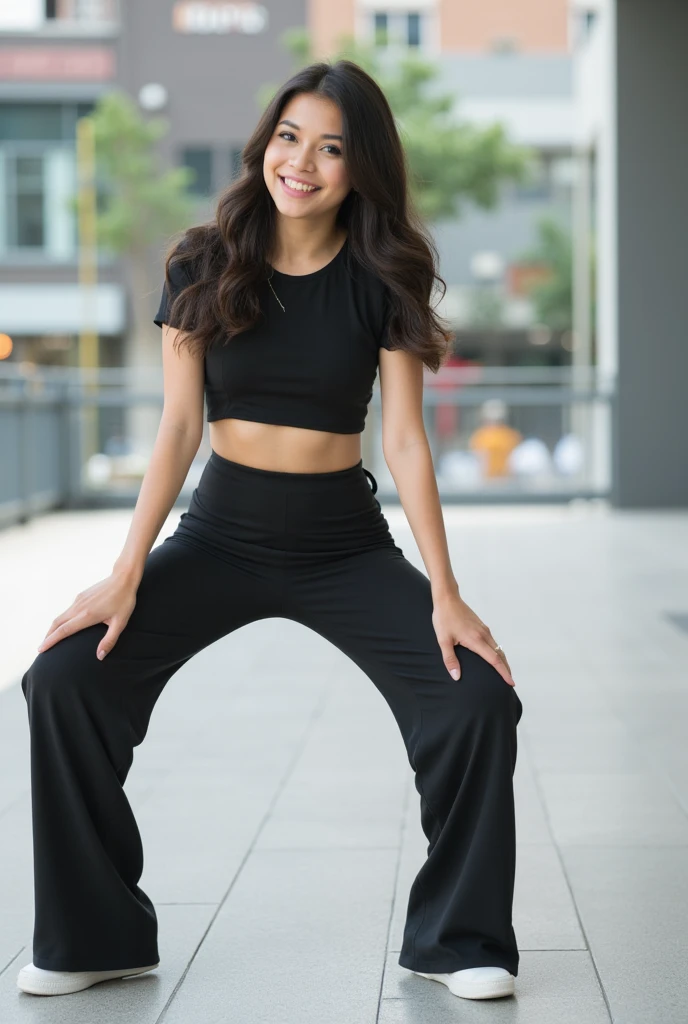 The girl is soaked in silver satin pants, Abundantly, standing in a deserted park early in the morning, smiles and enjoys, in his pants, He looks at his feet and rejoices