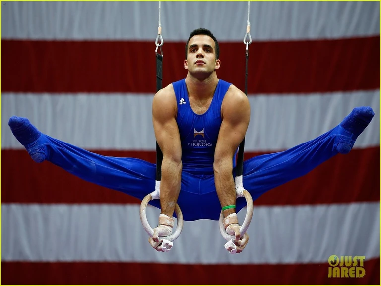 1boy, photorealistic, ultra realistic, masterpiece, best quality, 4k, young olympic male gymnast, slim athletic body build, wearing a men's gymnastic uniform, bodysuit, action poses, the crowd cheers, detailed faces, ultra realistic skin, Olympic Games, shot on Nikon d850 50mm, dlsr, RAW, cinematic lighting, 3 point lighting, flash with soft box