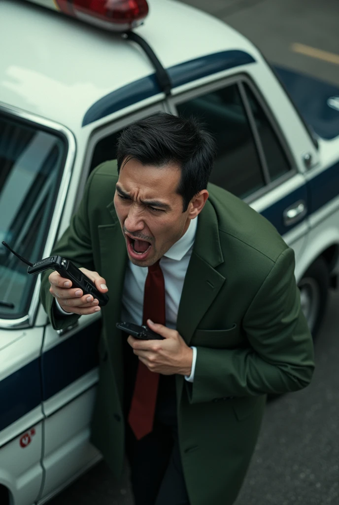 困っている男性 at side of police car,  scream and use transceiver, moss green big long coat, white shirt, red neck tie, Japan style police car, transceiver with code connected police car, view up, from above,