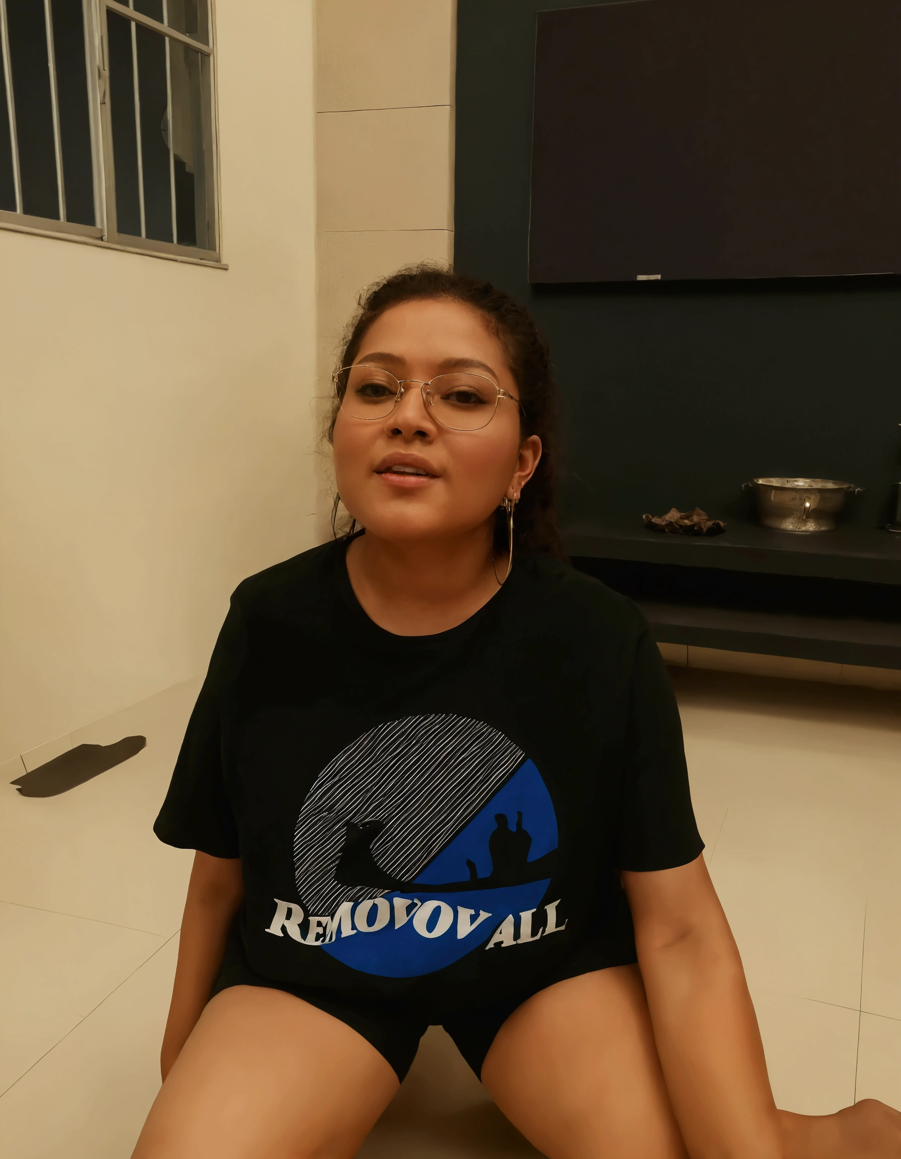 Candid photos display low quality and blurry. At night in a simple house, a healthy 20 year old chubby Indonesian girl wearing a “mvk” tank top with big breasts,  wearing sunglasses, was sitting on the couch with an Orange cat. Candid, This photo was taken in low quality with typical rural dim light.