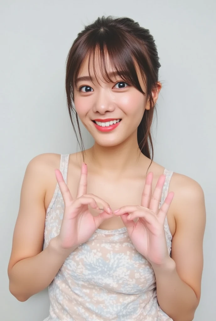 Only one smiling woman poses wearing cute pajamas with only her shoulders exposed, making a firm big heart shape with both hands, and holding them in front of her chest, View above collarbone、The background is a monotone 、
