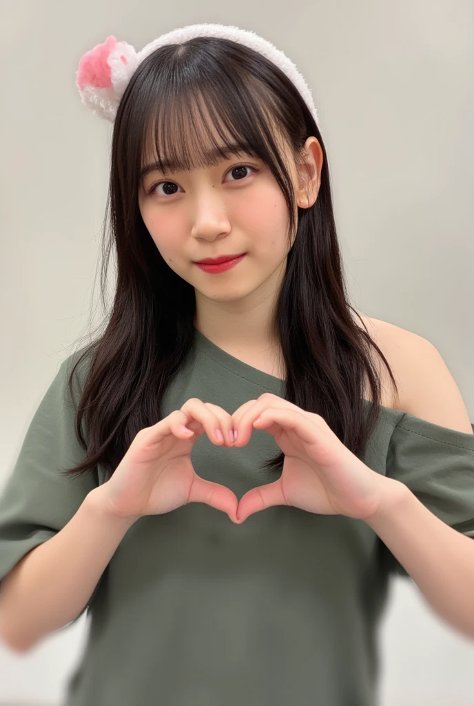 Only one smiling woman poses wearing a camisole, making a firm big heart shape with both hands, and holding it in front of her chest, View above collarbone、The background is a monotone 、
