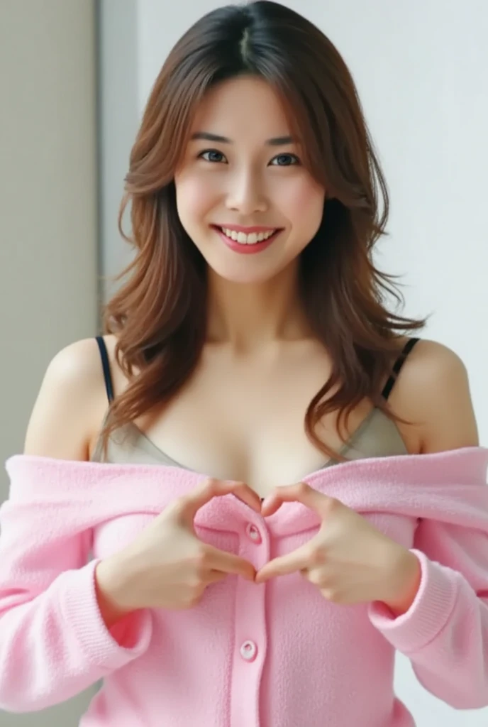 Only one woman with a cute smile wears cute, fluffy off-shoulder pajamas, makes a big heart shape with both hands, and poses them in front of her chest, View above collarbone、The background is a monotone 、
