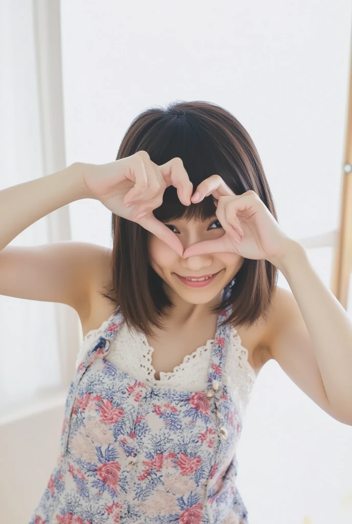 A smiling woman is posing alone wearing off-the-shoulder pajamas, making a firm big heart shape with both hands, and holding them in front of her chest, View above collarbone、The background is a monotone 、
