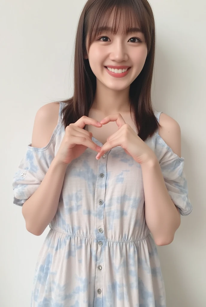 A smiling woman poses alone wearing off-the-shoulder pajamas in pastel colors that convey warmth simply by touching them softly and softly, making a firm, large heart shape with both hands, and holding them in front of her chest, View above collarbone、The background is a monotone 、
