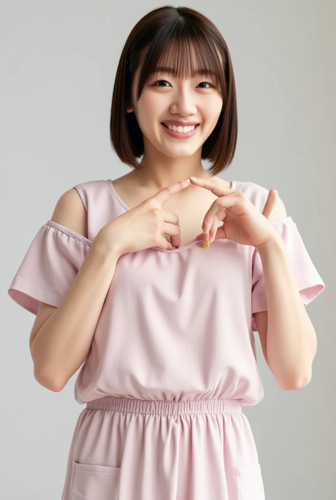 A smiling woman poses alone wearing off-the-shoulder pajamas in pastel colors that convey warmth simply by touching them softly and softly, making a firm, large heart shape with both hands, and holding them in front of her chest, View above collarbone、The background is a monotone 、
