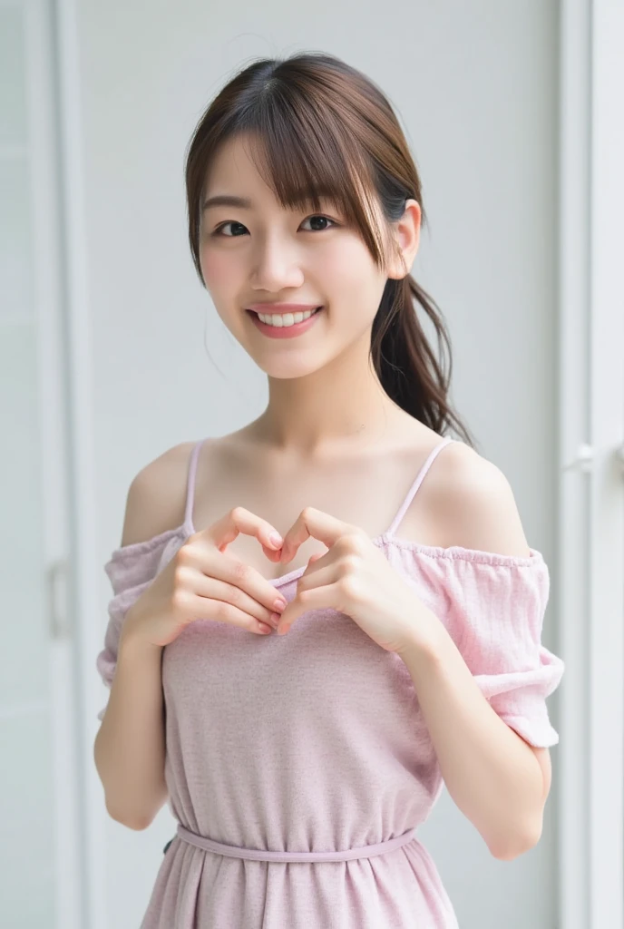 A smiling woman poses alone wearing off-the-shoulder pajamas in pastel colors that convey warmth simply by touching them softly and softly, making a firm, large heart shape with both hands, and holding them in front of her chest, View above collarbone、The background is a monotone 、
