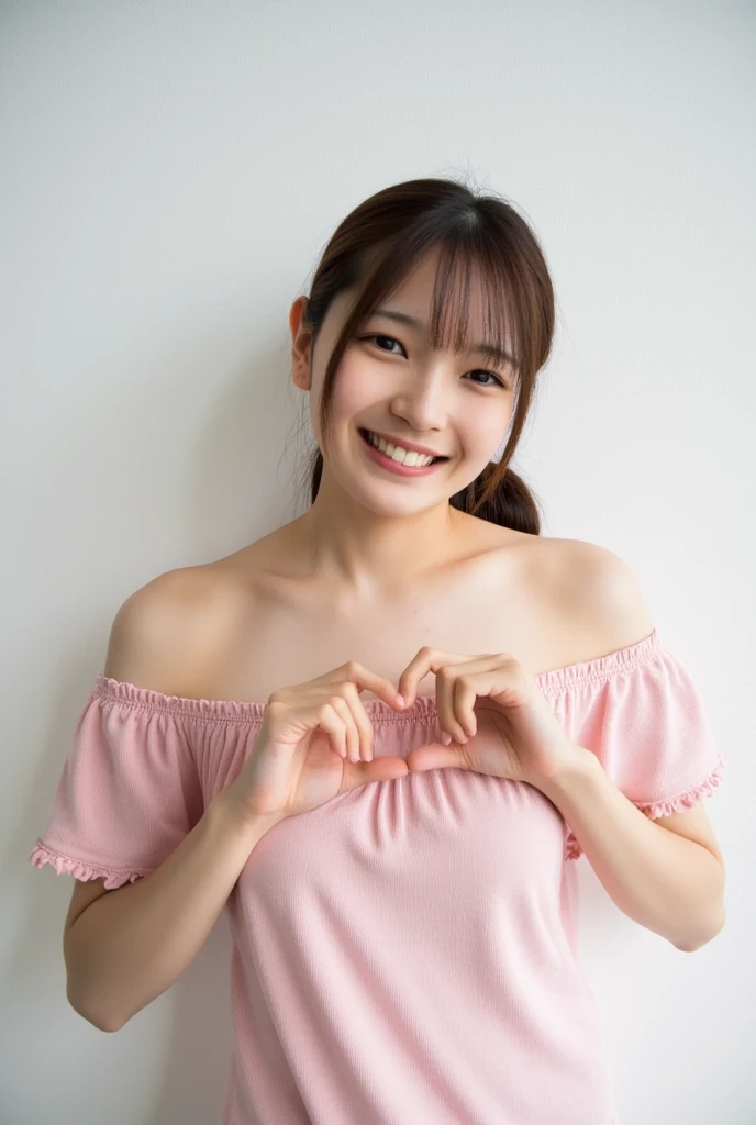 A smiling woman poses alone wearing off-the-shoulder pajamas in pastel colors that convey warmth simply by touching them softly and softly, making a firm, large heart shape with both hands, and holding them in front of her chest, View above collarbone、The background is a monotone 、
