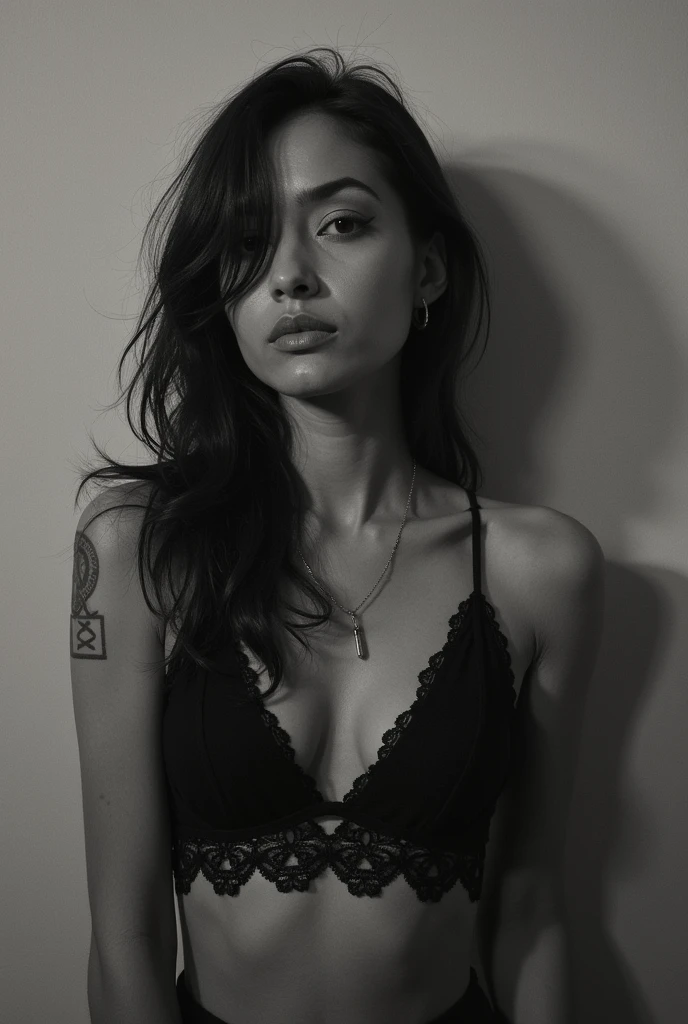 Make a black and white picture. A beautiful 30 year old Indonesian woman, he is serial, long hair tied half messy, he was naked wearing only thin underwear, his hair was almost visible, both hands holding her breasts, On his stomach there is a tattoo of CAPTAIN JACK in a gothic font with a floral motif. There is a tattoo of the goddess Athena on her left thigh.