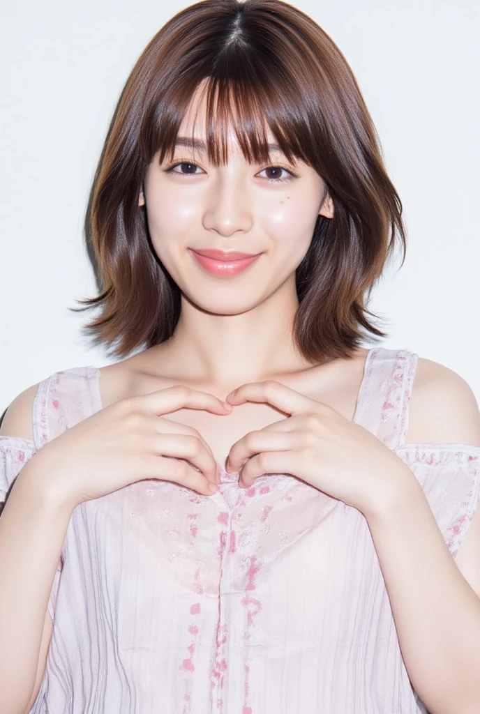 A smiling woman poses alone wearing off-the-shoulder pajamas in pastel colors that convey warmth simply by touching them softly and softly, making a firm, large heart shape with both hands, and holding them in front of her chest, View above collarbone、 background is monotone、
