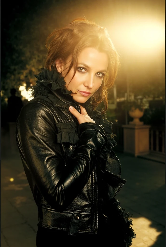 A stunning portrait of Britney Spears, blonde hair, captured in a glamorous, edgy aesthetic, showcasing a dark, leather jacket with ruffles, vibrant eye makeup, and a sophisticated hairstyle, evoking a powerful and confident persona; the image features rich golden hour lighting and a shallow depth of field, using an 85mm lens with warm color grading for vintage vibes, and a slightly low angle for a flattering pose.  Focus should be on the intricate details of her makeup, fashion statement, and the evocative atmosphere. britney. britney spears.