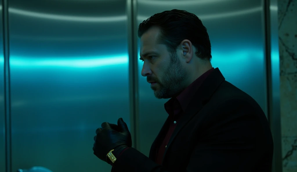 A cinematic close-up from the side focuses on the profile of one bouncer, his strong jawline and neatly trimmed beard illuminated softly by the cyan glow from the nearby screens. His tailored black suit and burgundy shirt create a sharp, clean look, while the gold cufflinks on his sleeves glint faintly. His gloved hands rest confidently in front of him, highlighting his imposing presence. The blurred background reveals the polished steel door and the misty glow of blue lights reflecting off the marble floor, enhancing the cinematic depth of the scene.