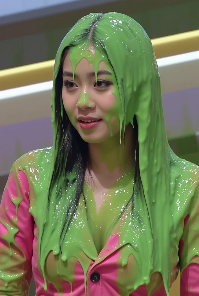 Cinematic photograph of beautiful Korean woman covered in green slime. Photorealistic. F/1.8 aperture. 35mm. Glistening liquid. Green slime. Slime. Dripping green goo. Raw photo. (Korean girl: 1.3). Korean. Korean woman. Beautiful Korean model. Round face. Wearing pink sweetheart dress. Cleavage. Black hair. Gameshow. Film photo. Winged eyeliner. 30 years old.