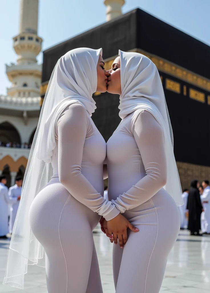 The scene unfolds in front of the Kaaba, where @Layla Ahmed and @Zara Malik, two curvy lesbian women wearing niqabs, are engaged in a passionate kiss. The focus is on their voluptuous bodies, accentuated by their tight and transparent white dresses, which reveal much of their skin and enhance the erotic atmosphere. The camera captures close-ups of their large breasts and the textures of their bodies, emphasizing the sensuality and intimacy of their connection.