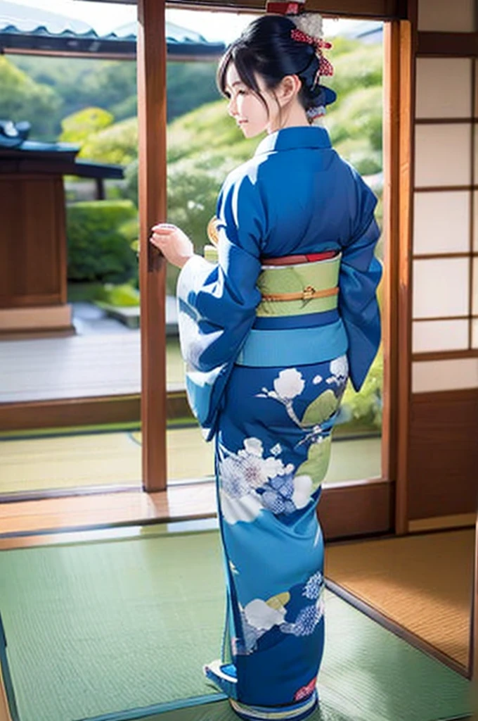 A woman wearing a plain blue kimono、 back view