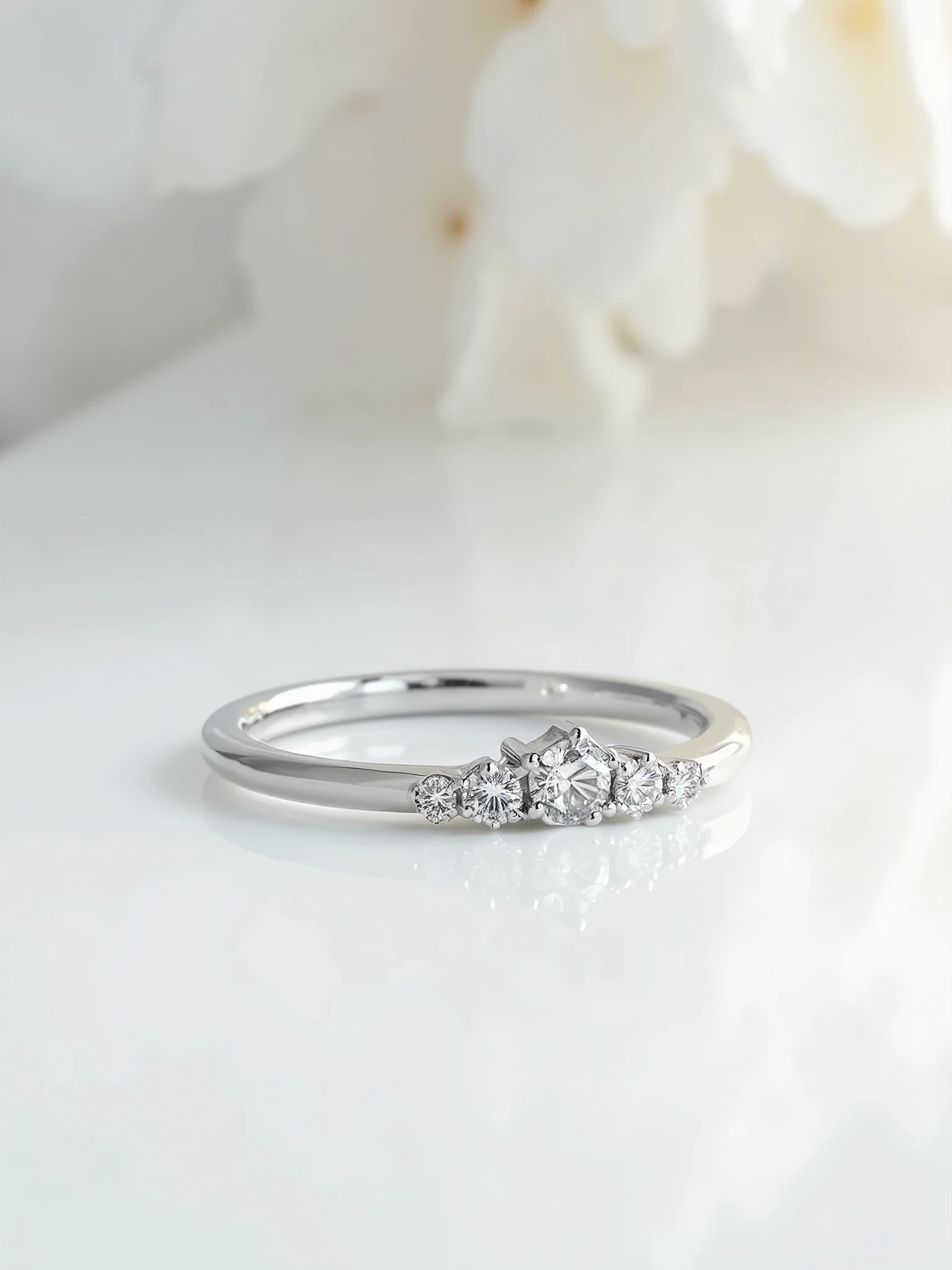 white gold half-rod wedding ring with diamonds of different sizes, set at level . The diamonds are inside the metal and are not held by claws. the view is from the front , the ring is resting on the floor and the background is white . It must be totally realistic .