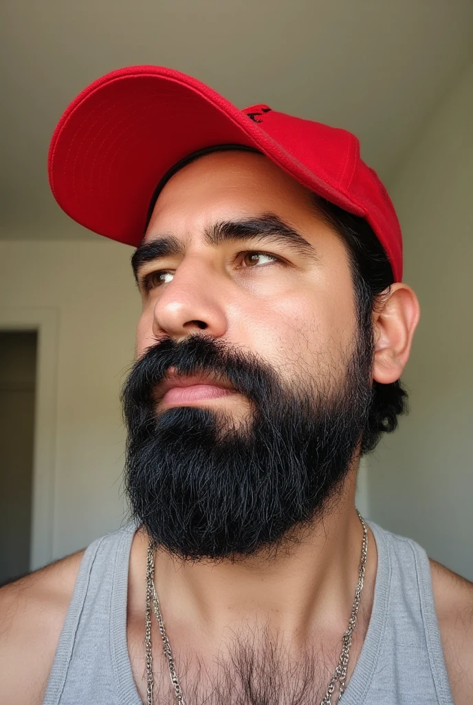  A view from the bottom up of a 38-year-old man with a rough appearance but refined .  He wears a perfectly outlined beard that highlights the symmetry of his face ,  accompanied by a carefully groomed thick mustache .  His complexion is slim but athletic ,  with defined muscles that stand out in a natural way .  His skin is clean , tattoo-free , , which accentuates the contours of his stylized physique .  He wears a red cap with a letter  "a" on the front, slightly tilted,  adding a modern and distinctive touch to his style .  His dark hair ,  Short and slightly messy ,  complements his sleek but carefree appearance .  Thinner metal chains adorn his neck ,  providing a contemporary and sober look .  The scene takes place in a minimalist room illuminated with warm light that enhances every detail of her face and figure. the background,  with a white door and walls in neutral tones ,  ensures that all attention is focused on her defined style and charismatic presence from this higher perspective .