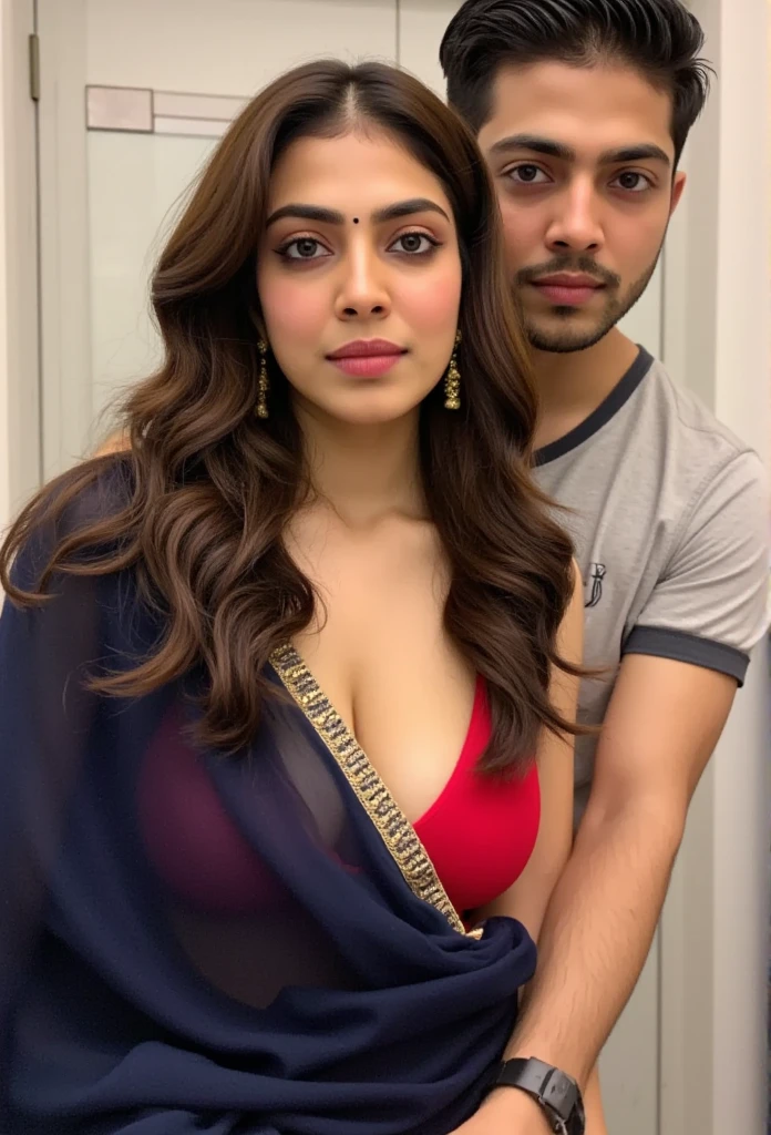 woman, dark blue saree, red blouse, navel, cleavage, saree dropped on the floor. her husband standing behind and squeezing her hip flesh, biting her neck. she is moaning in pleasure, in bathroom and gazing at the camera.
