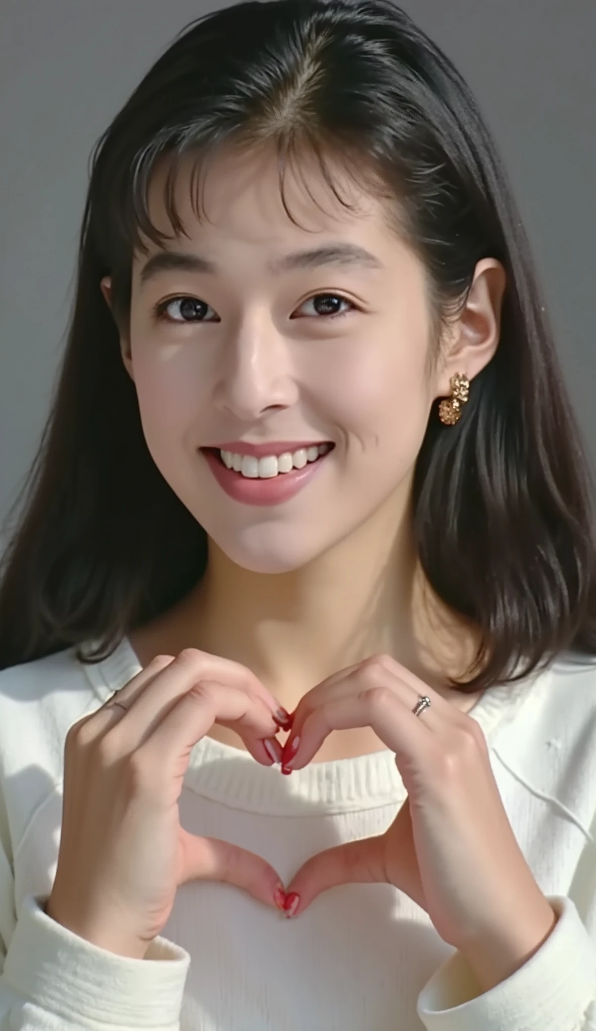 high definition 、 1 woman with a cute smile、 Wear fluffy off-the-shoulder pajamas and make a big heart in front of your chest with your own hands, Photo Mapping、Physically based rendering、 high image quality、 high definition 、1080P、 rich details 、( Stunning Features :1.35)、( detail eyes)、Delicate clavicle、 Various Poses、 A very realistic and detailed upper body portrait of a young woman。The skin is beautiful、 soft light reflecting high on her cheeks .、 Tiny pores and hair follicles、 You can see even the thinnest blood vessels 。The skin is smooth、natural flushing of cheeks 、Healthy glow。 The eyes are large and clear blue、Her iris has fine patterning、 Light is reflecting and shining in the eye。 There is a slight shadow under her eye 、 Her eyelashes are long and naturally curled。 her lips are soft pink 、Smooth texture with a natural glow、 Slightly reflects light。 background is pale black and white gradation .、 The focus is entirely on the face and upper body。 Realistic shadows and textures、 picture-like depiction.。