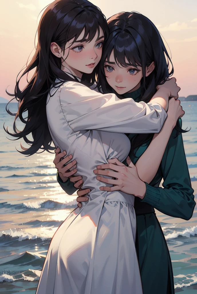 Two women are hugging each other; one is facing outward, while the other is embracing her from behind. The background is a seaside setting.