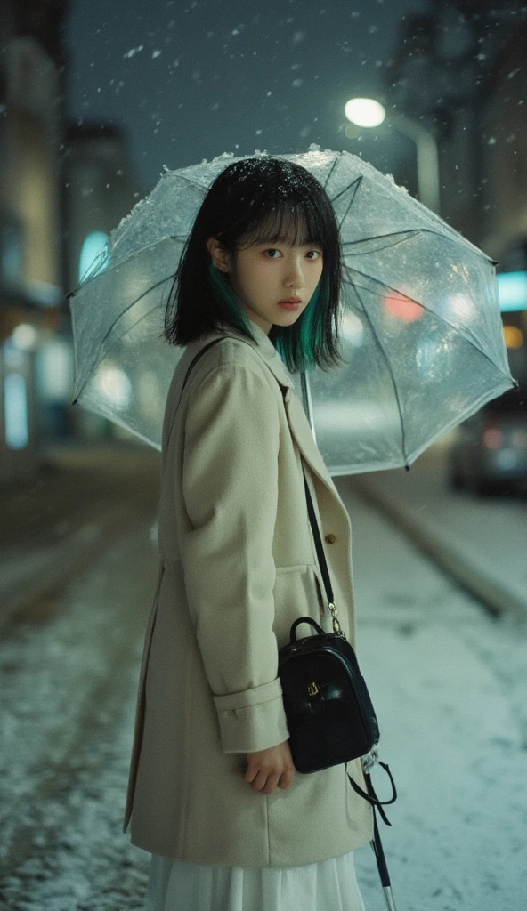 A 15-year-old girl with short black hair and bangs. A snowy night. The strong light from the flash made some of the snowflakes overexposed. The moving movement was captured during the movement. She turned to the side and looked at the camera. A cute girl with short straight two-tone hair (black and green) and bangs is standing on the street. She is wearing a long-sleeved winter coat. She is carrying a black rice bag. She is holding a transparent umbrella. She is wearing black shoes and a white skirt (upper body). ((Close-up)) ((Looking at the camera)) Her pose is confident and stylish, staring at the camera defiantly. The camera angle is slightly low, emphasizing her outstretched arms. [Photography, Filmmaking, Street photography], [Candid street style], [Shallow depth of field, 35mm lens, Rough film texture, Cool tones with soft blues and grays, Soft ambient light from street lamps, Snow bokeh effect]