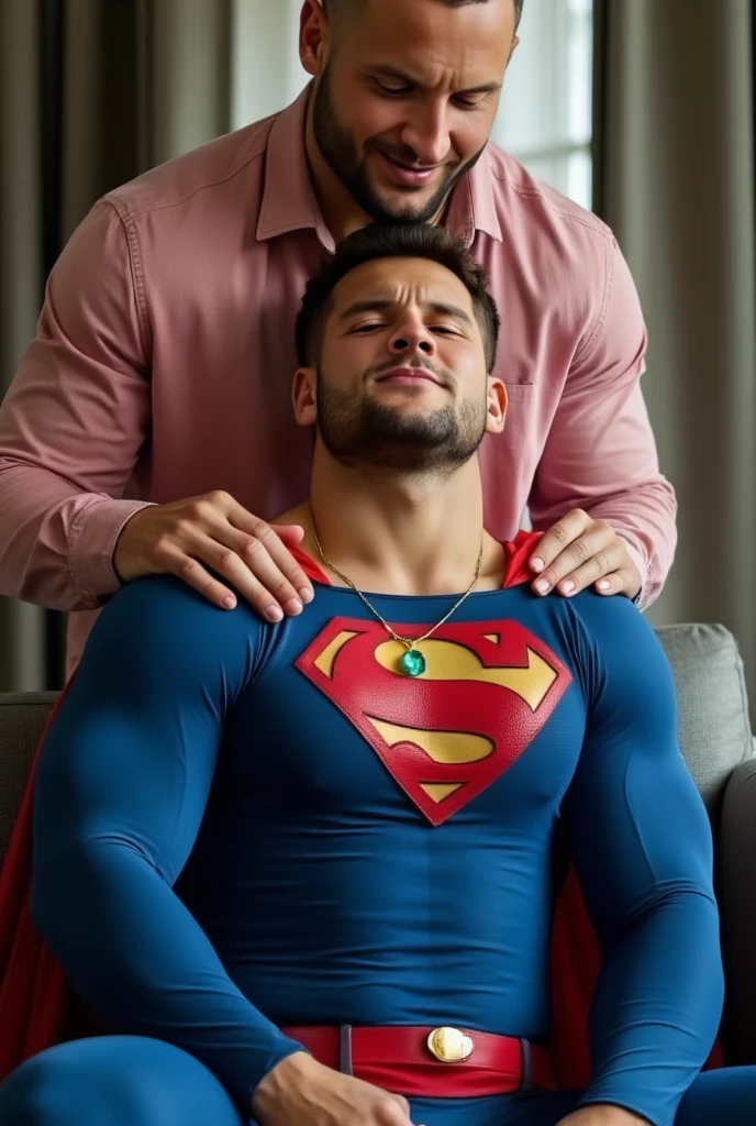 full body shot of a muscular attractive, nick bosa good looking man with Short stubble, muscular thighs, dressed in a blue Superman costume. He has a pained expression, orgasm face, eyes closed, mouth slightly open. He is at home on sofa, a bright emerald green crystal pendant hanging from his neck. He appears weak and in pain, with his eyes closed. Behind nick bosa stands an attractive, bald, white man wearing an unbuttoned pink denim shirt, touching Superman's chest with his hands. bald, white man kiss Superman.Thy kiss each oter. Superman can't refuse.Superman love kiss.