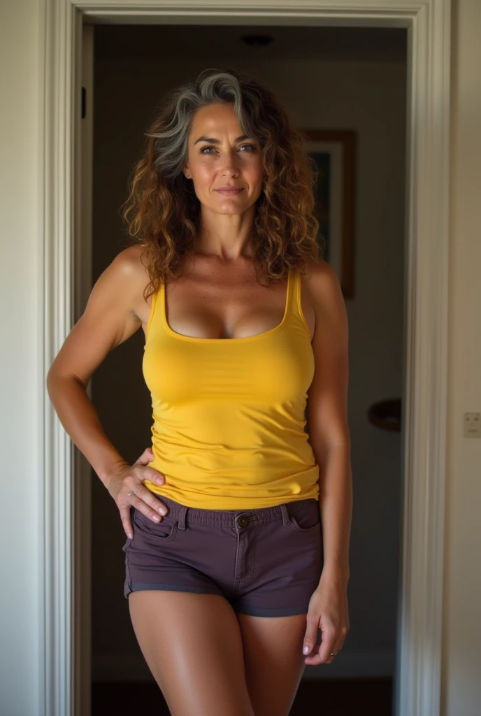 Julia Louis-Dreyfus wearing pear crop top and thong and smiling