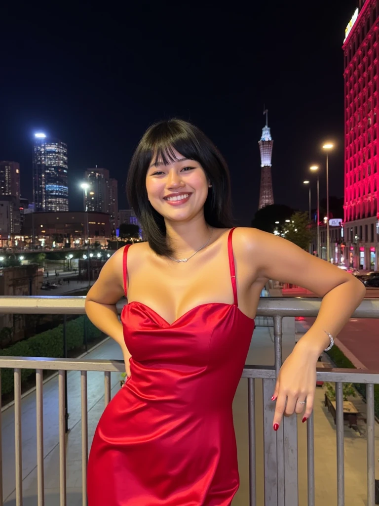 In this image, a young woman is the central figure. She is posing confidently on a metal railing in an urban setting at night. She is wearing a red satin dress with thin straps and a sweetheart neckline, which complements her short hair. The woman is smiling and appears joyful, with her hands resting on the railing.

The background showcases a cityscape, with tall buildings illuminated by city lights. There is a distinctive red building to the right and another structure with a lit-up tower in the distance. The lighting in the image is primarily artificial, emanating from the surrounding buildings and streetlights.

Overall, the atmosphere of the photo is vibrant and lively, capturing the essence of a night out in the city.