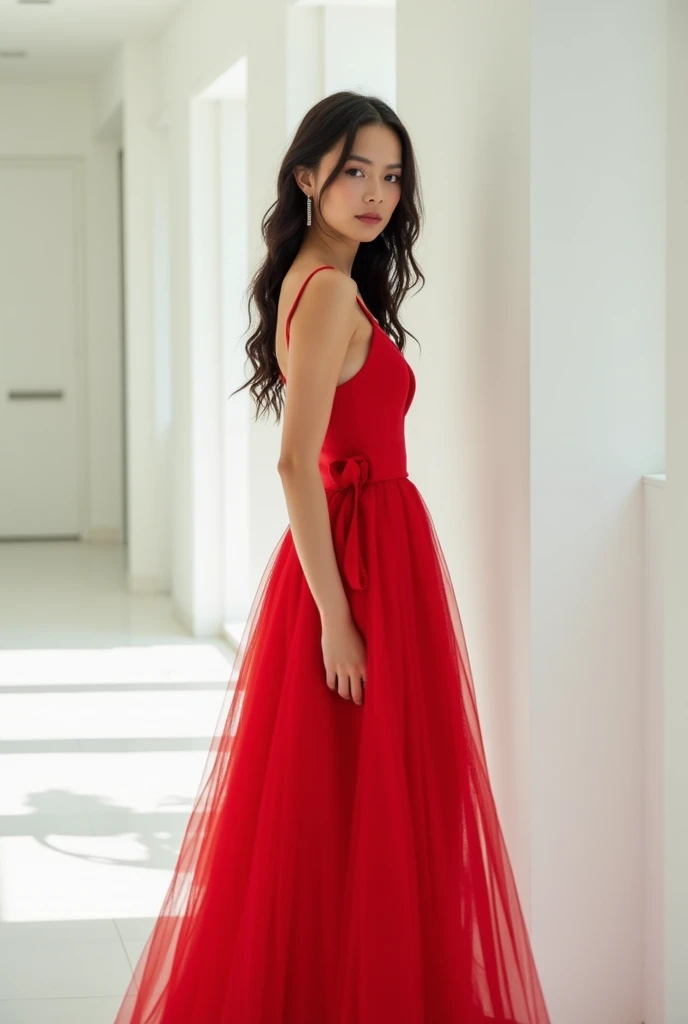 Photo of JennaOrtega in a red dress in a white room